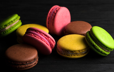color macaroons on a black background