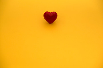 red heart on a yellow background