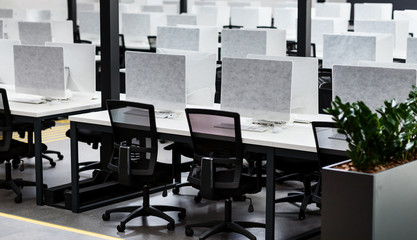 Open space interior with covered computers, no people