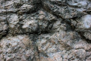 Rock texture background. Fragment of natural stone wall