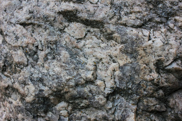 Rock texture background. Fragment of natural stone wall