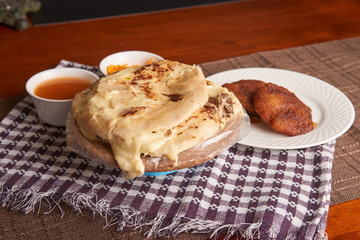 Close up photo of pupusas dish with nuegados, a traditional meal from El Salvador