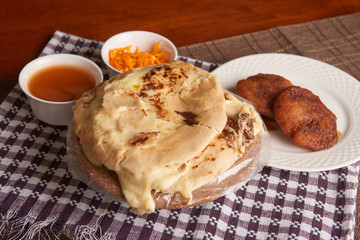 Close up photo of pupusas dish with nuegados, a traditional meal from El Salvador