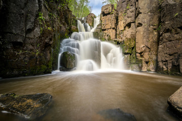 Fototapeta na wymiar Ukowski waterfall in the Irkutsk region in Russia in the summer