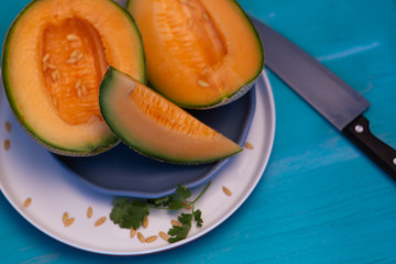 Melon on blue table.