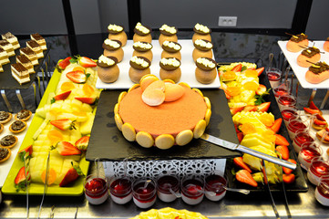French sweet buffet and fruits .