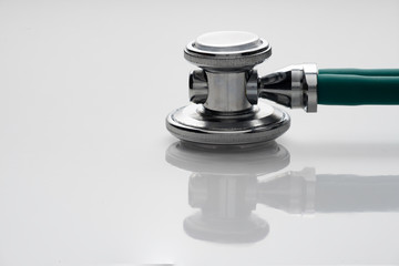 stethoscope detail on white background.
