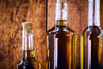 alcoholic beverage bottles with wooden rustic background