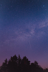 Naklejka premium Landscape with blue Milky Way. Night sky with stars. Beautiful milky way taken in Ukraine during a clear night