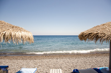 black beach with umbrella
