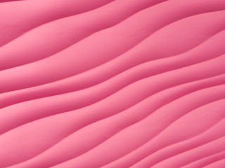 Fototapeta premium pink waved pattern close up. abstract textured pink painted back