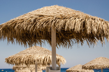 straw umbrellas on the beach