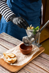 cooking minced meat for fish cutlets with ingredients on a table with a meat grinder. Fillet of fish. Dish, main dish. Fasting food seasoning. Mincing Fish. Making Fish .