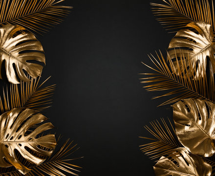 Shiny Luxurious Gold Painted Tropical Monstera Palm Leaves Border Frame On Abstract Black Background Isolated