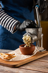 cooking minced meat for fish cutlets with ingredients on a table with a meat grinder. Fillet of fish. Dish, main dish. Fasting food seasoning. Mincing Fish. Making Fish .
