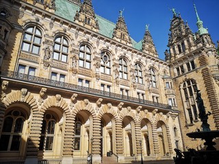 Fototapeta na wymiar unset at city town hall with blue sky Hamburg Germany