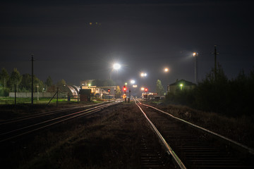 night railroad with lights and sky