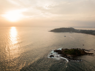 Fototapeta premium Golden sunset on Mirissa beach. Drone shot
