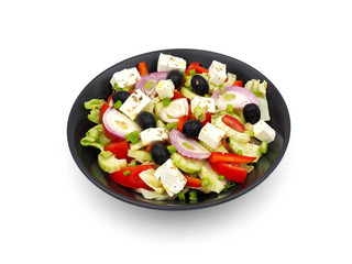 Greek salad isolated on white background