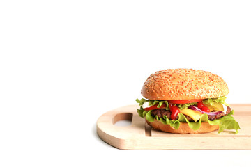 classic cheeseburger on board on isolated on white background