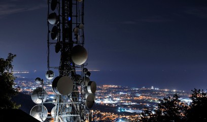 Telecommunications tower, antenna and satellite dishes.  Cellular station for smart city connect,...