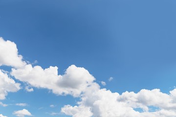 Scenic sky background. Blue sky with fluffy white clouds. Copy space