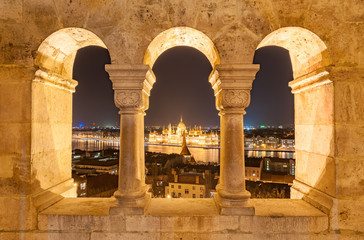 Night view of the Hungarian Parliament Building on the bank of the Danube in Budapest, Hungary