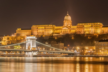 Fototapeta na wymiar Night view of the Szechenyi Chain Bridge over Danube River and Royal Palace in Budapest,