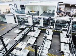 Top view of empty IT office, covered computers, no workers
