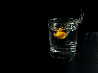 A glass of water with a soluble tablet