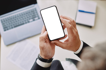 male hands holding a phone with a blank screen, close-up. Copyspace ready for design or text