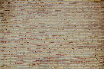 brown brick wall with many square bricks, background with architectural elements
