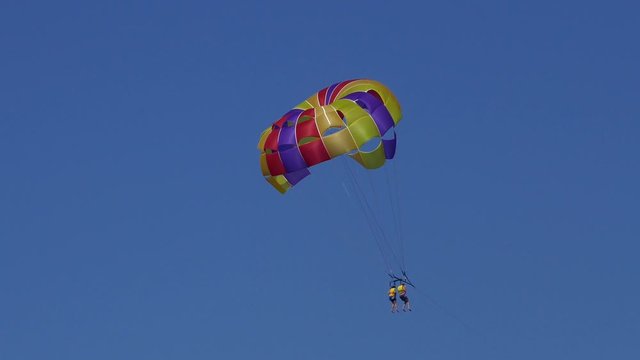 Couple doing boat parachute together