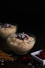 Rice pudding with cinnamon and fresh raspberries