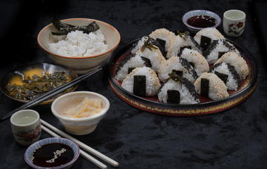 Onigiri filled with omelette and seaweed simmered in soy sauce along with sides