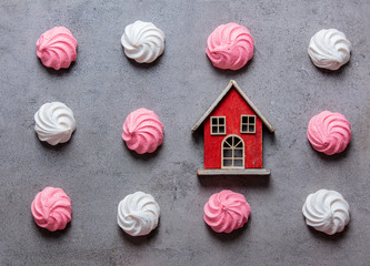 pink and white meringues with toy house