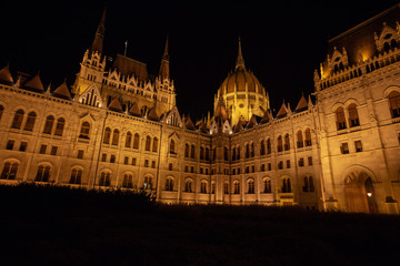 Fototapeta na wymiar Hungarian Parliament building in the city of Budapest. Budapest at night time. A sample of neo-gothic architecture, Budapest tourist attraction