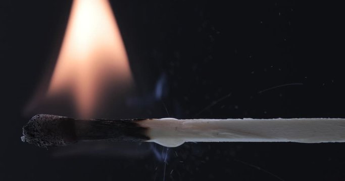 Match lighting and burning till the end and finally disappears from the flame on black background