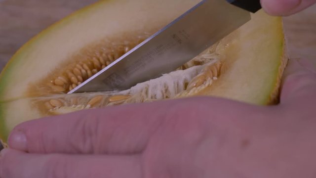 Cutting Half a Fresh Cantaloupe. Fruit, Exotic fruit