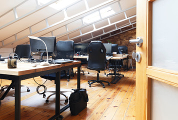 Empty interior office. Tables with computers and chairs