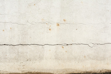 Texture of a white wall with horizontal crack