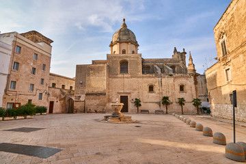 Fototapeta na wymiar Small Square and Fountain in Front of Saint Teresa's Church - Chiesa di Santa Teresa at Monopoli - Apulia - Puglia - Italy