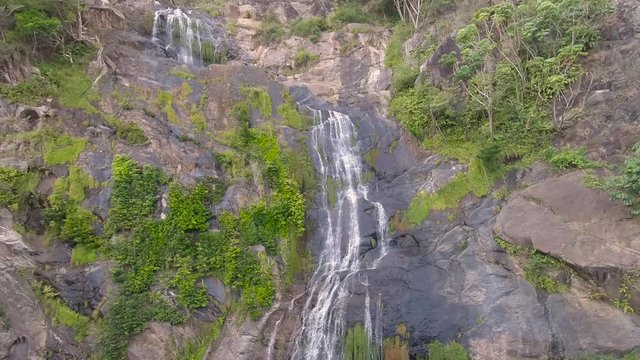 Kuranda Scenic Railway Train. Tourist train journey across waterfalls, rainforest and jungles in Cairns Australia. View of beautfiul Stoney Creek Falls.  Slow Motion.