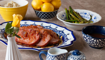 Turkey Ham Dinner Served on Blue and Yellow Dishes