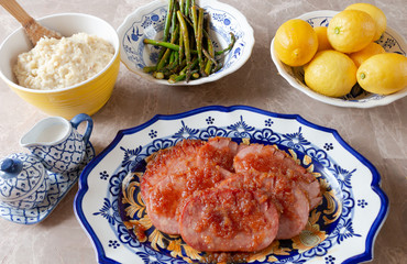 Turkey Ham Dinner Served on Blue and Yellow Dishes