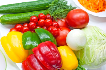 Various fresh vegetables for salad preparation, close-up