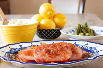 Turkey Ham Dinner Served on Blue and Yellow Dishes