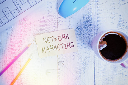 Writing note showing Network Marketing. Business concept for Pyramid Selling Multi level of trading goods and services Technological devices colored reminder paper office supplies