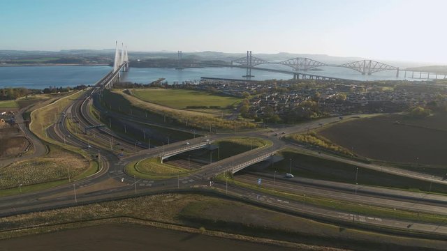 Drone shot of the 3 bridges in South Queensferry - Forth rail bridge, Queensferry crossing and Forth Road Bridge,