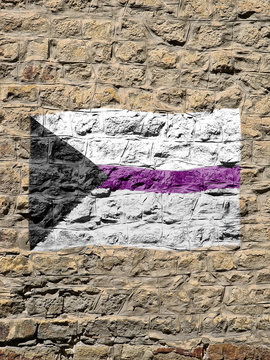 Rocky wall with the demisexual flag painted on it.